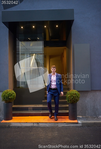 Image of business man entering  hotel