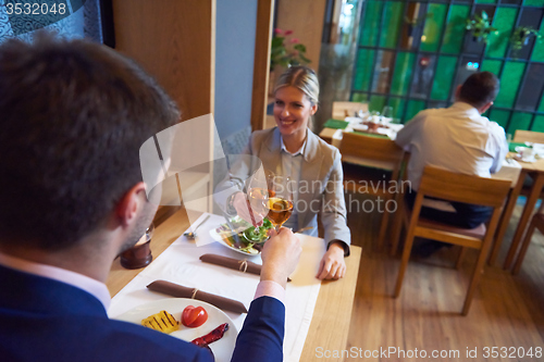 Image of business couple having dinner