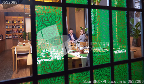 Image of business couple having dinner