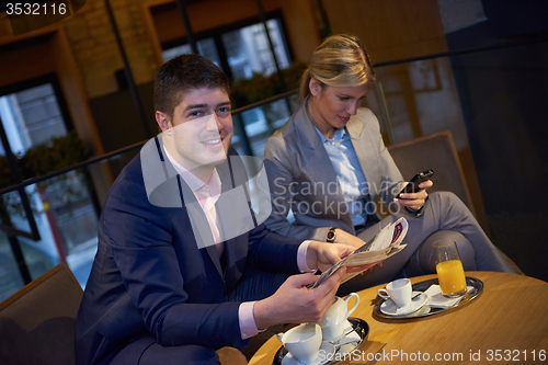 Image of business couple take drink after work