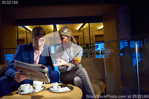 Image of business couple take drink after work