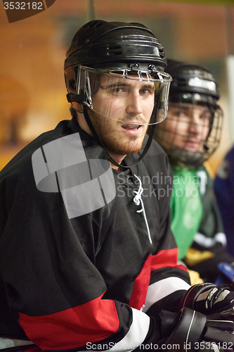 Image of ice hockey players on bench