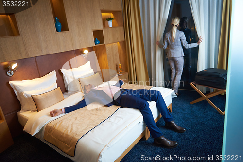 Image of young couple in modern hotel room