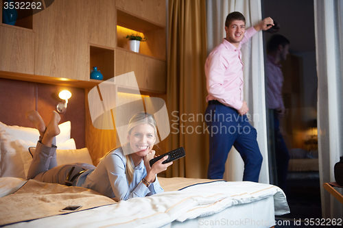 Image of young couple in modern hotel room