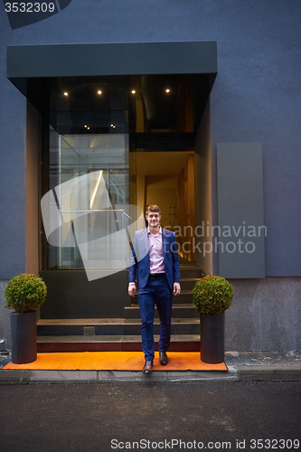 Image of business man entering  hotel