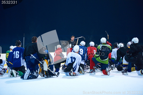 Image of ice hockey players team meeting with trainer