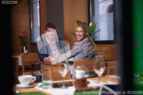 Image of business couple having dinner