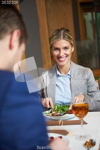 Image of business couple having dinner