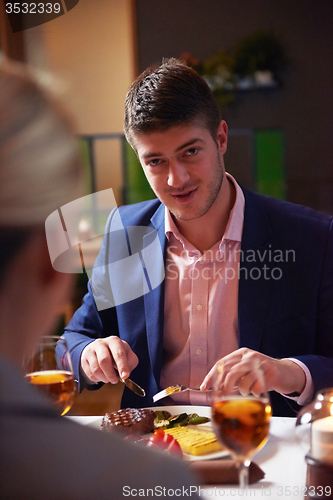 Image of business couple having dinner