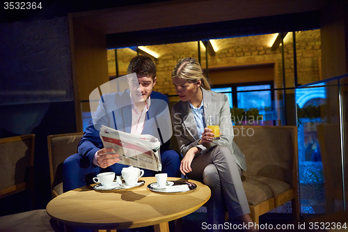 Image of business couple take drink after work