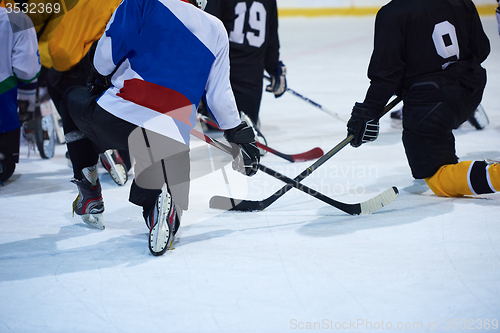 Image of ice hockey players team meeting with trainer