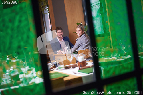 Image of business couple having dinner