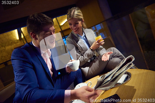 Image of business couple take drink after work