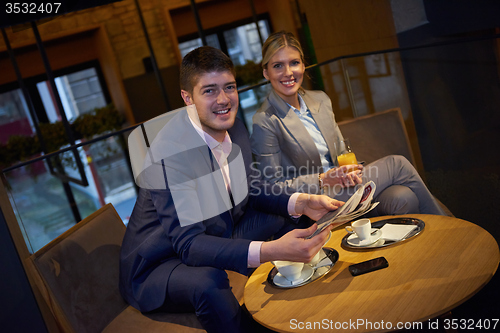 Image of business couple take drink after work