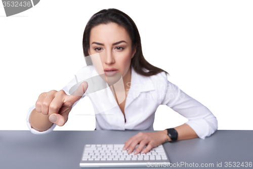 Image of Business woman pointing at imaginary button