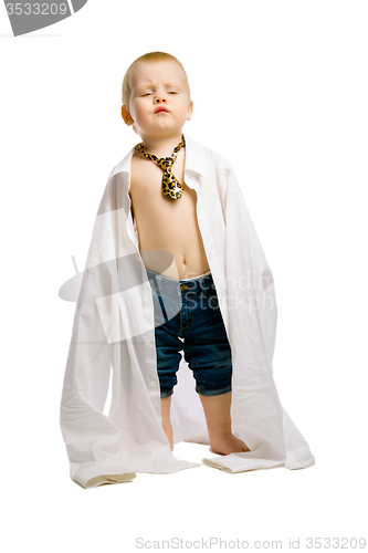 Image of baby boy in a huge shirt and tie. Studio