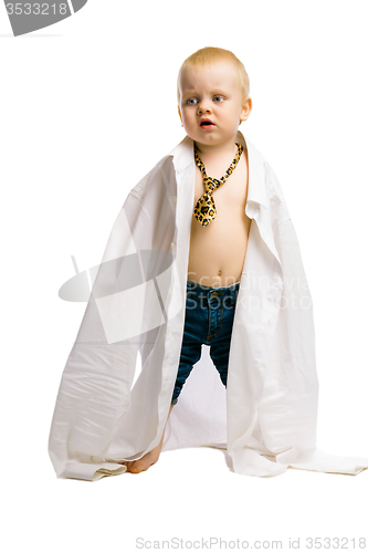 Image of baby boy in a huge shirt and tie. Studio