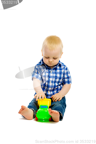 Image of Baby boy playing with toys. isolated