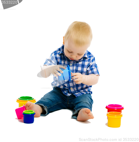 Image of Baby boy playing with toys. isolated