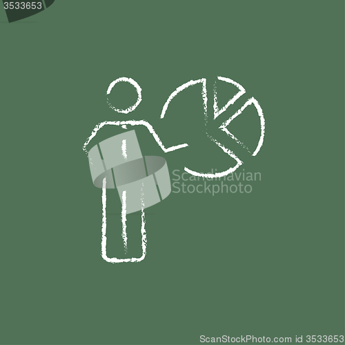 Image of Businessman pointing at the pie chart icon drawn in chalk.