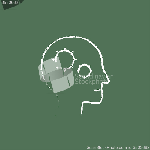 Image of Human head with gear icon drawn in chalk.