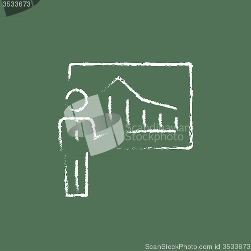 Image of Businessman with infographic icon drawn in chalk.