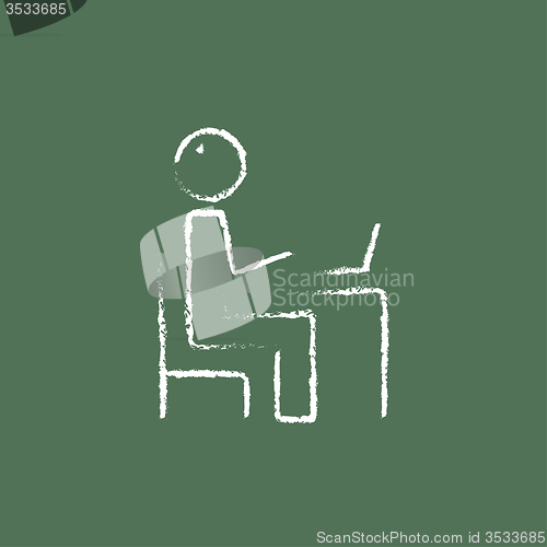 Image of Businessman working at his laptop icon drawn in chalk.