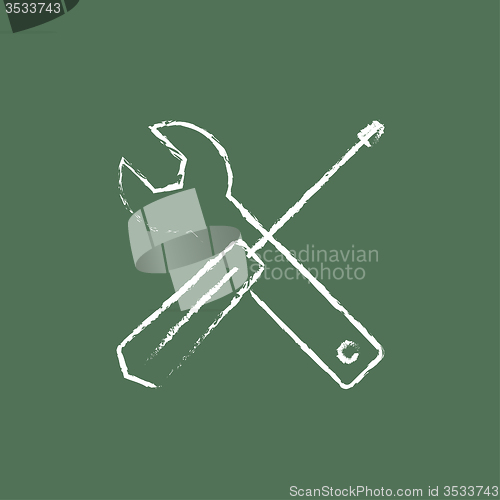 Image of Screwdriver and wrench tools icon drawn in chalk.