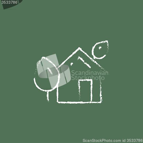 Image of Eco-friendly house icon drawn in chalk.