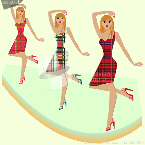 Image of Fashion models posing on podium in various checkered dresses