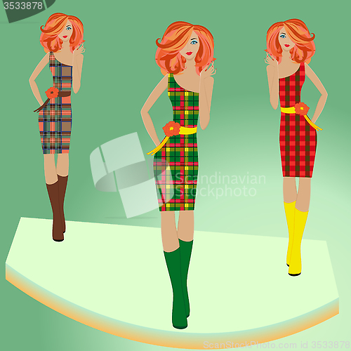 Image of Fashion models posing on podium in different checkered dresses