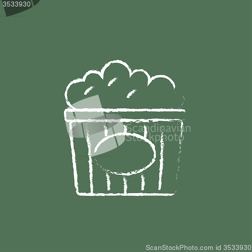 Image of Popcorn icon drawn in chalk.