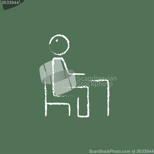 Image of Student sitting on a chair in front of the desk icon drawn chalk.