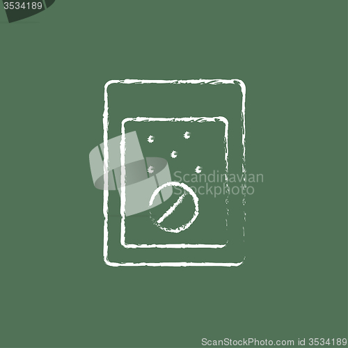 Image of Tablet into a glass of water icon drawn in chalk.