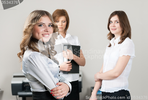 Image of Pretty business lady smiles in office