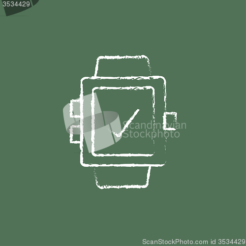 Image of Smartwatch with check sign icon drawn in chalk.