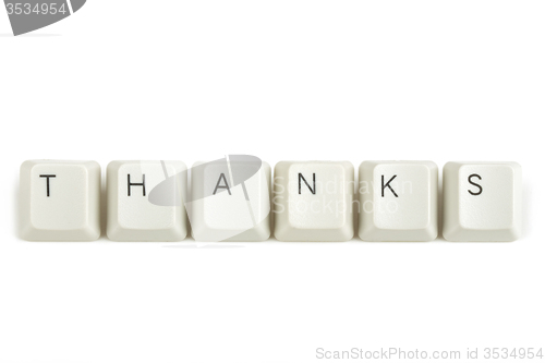 Image of thanks from scattered keyboard keys on white