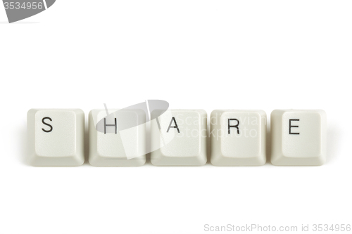 Image of share from scattered keyboard keys on white