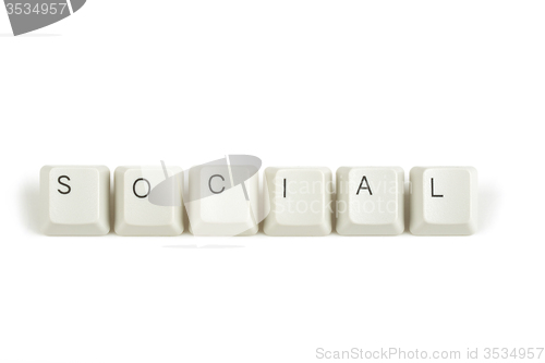 Image of social from scattered keyboard keys on white