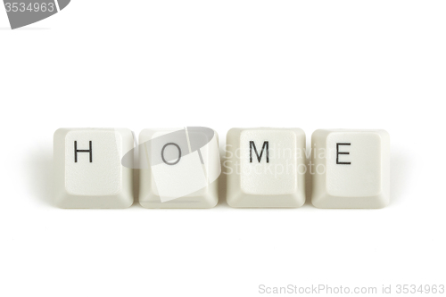 Image of home from scattered keyboard keys on white