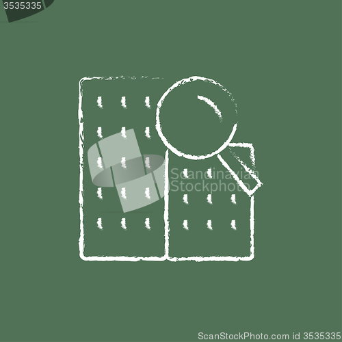 Image of Condominium and magnifying glass icon drawn in chalk.