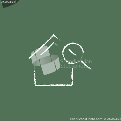 Image of House and magnifying glass icon drawn in chalk.