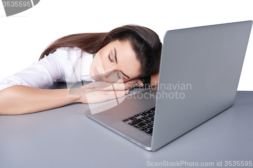 Image of Businesswoman asleep on her laptop