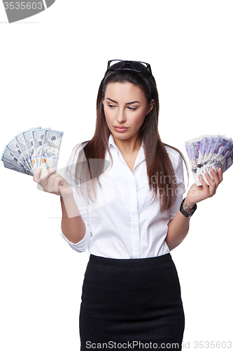 Image of Business woman holding British pounds