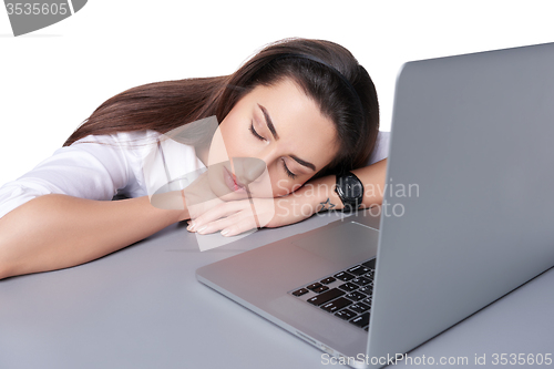 Image of Businesswoman asleep on her laptop