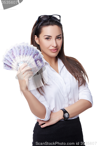 Image of Business woman holding British pounds