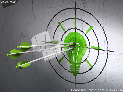 Image of Finance concept: arrows in Light Bulb target on wall background