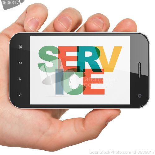 Image of Business concept: Hand Holding Smartphone with Service on  display