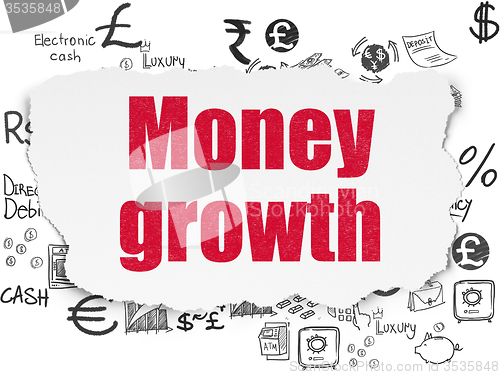 Image of Currency concept: Money Growth on Torn Paper background