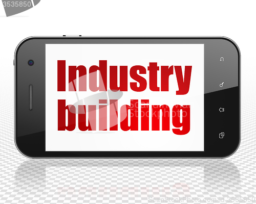 Image of Industry concept: Smartphone with Industry Building on display